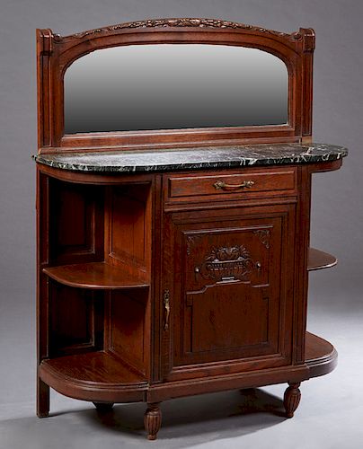 French Carved Oak Henri II Style Marble Top Sever, c. 1880, the arched crown over a wide beveled mirror splash, above a highly figured rounded corner 
