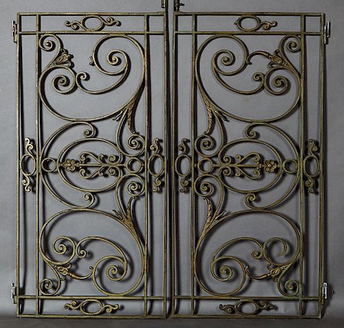 Pair of French Wrought Iron Window Grates, early 20th c., with scrolled and floral decoration, each H.- 46 3/4 in., W.- 23 in.