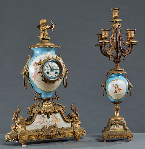 French Sevres Style Porcelain and Gilt Spelter Mantle Clock, late 19th c., with a gilt spelter cupid surmount atop a bleu d'celeste porcelain globe cl