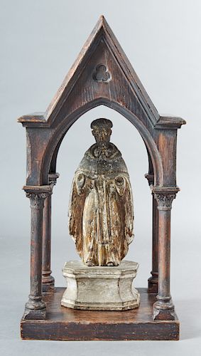 Spanish Carved Wooden Santo, 18th c., of St. Francis, with original paint, on an integral octagonal sloping wood base, presented with a Gothic style o