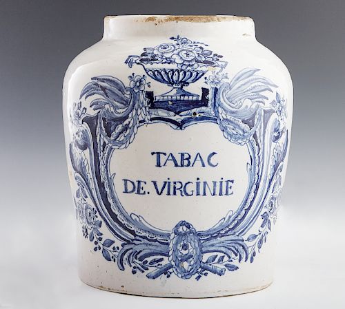Large Delft Tobacco Jar, 18th c., of baluster form, the side painted with "Tabac de Virginie" within a frame of flowers and birds, now lacking the lid