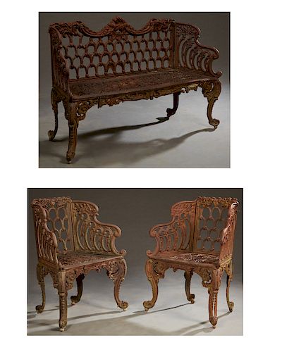Three Piece Cast Iron Patio Set, 20th c., consisting of a settee and a pair of armchairs, with pierced "Horseshoe" design backs with relief floral and