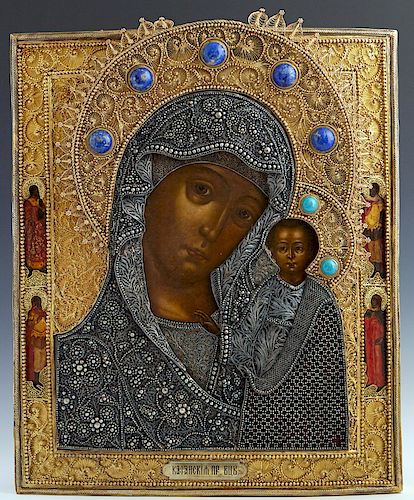 Russian Icon of the Virgin of Kazan, Moscow, 1856, with a gilt silver filigree oklad mounted with cabochon semi-precious stones with a maker's mark of