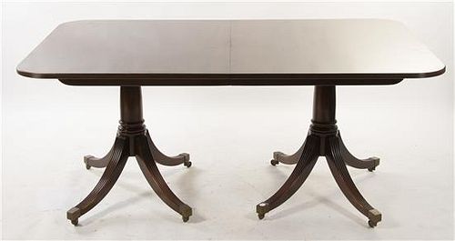 A Georgian Style Mahogany Double Pedestal Dining Table, Height 28 3/4 x width 68 x depth 44 inches.