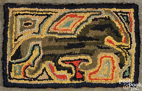 Hooked rug of a running horse