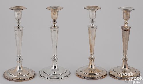 Set of four sterling silver candlesticks