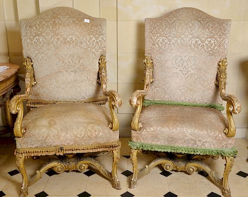 Pair of Louis XV style gilt armchairs with upholstered backs and seats on cabriole legs ending in hairy hoof feet with X stretcher a...