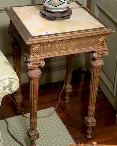 Louis XVI style gilt decorated table with inset onyx top. 
height 29 1/4 inches, top: 18" x 18" 
***If this lot is not picked up on ...