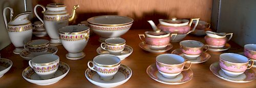 Paris porcelain nineteen piece tea set including seven cups and saucers, teapot, sugar, creamer, waste bowl, and large bowl. 
teapot...