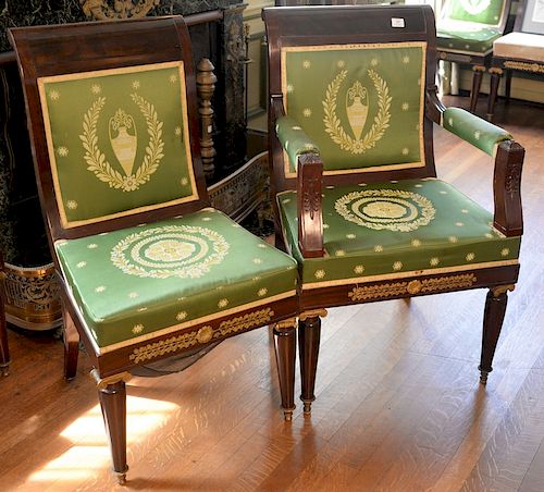 Set of twelve French empire style mahogany dining chairs with gilt bronze mounts, two with arms. 
height 39 1/2 inches, width 25 inc...