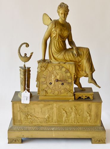 Gilt bronze mantel clock mounted with winged female figure, 19th century. 
height 19 inches, width. 13 1/2 inches 
***If this lot is no