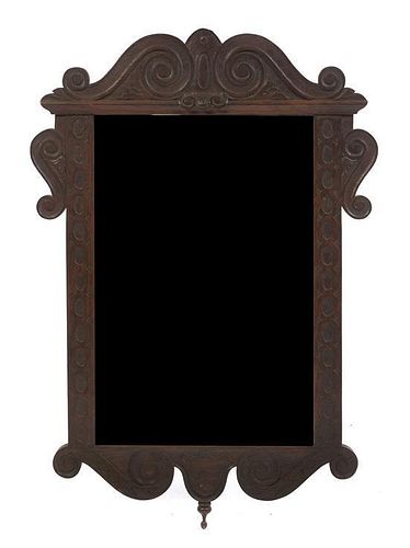 An American Carved Oak Mirror, Wallace Nutting, Height 36 x width 24 1/2 inches.