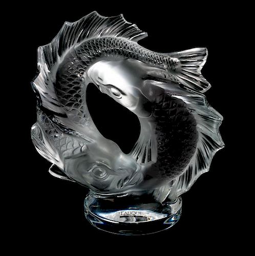 * A Lalique Frosted and Molded Glass Figural Group Height 11 inches.