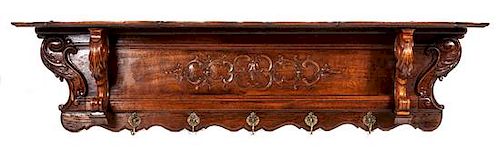 A Carved Wall Hanging Coat Rack Height 19 x width 70 x depth 9 1/2 inches.