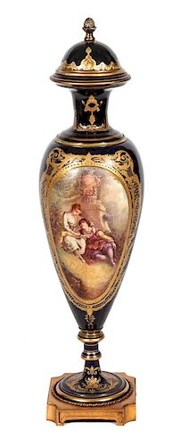 * A Royal Vienna Style Porcelain Lidded Urn Height 33 inches.