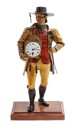 * A Tole Figural Clock Height 14 1/2 inches.