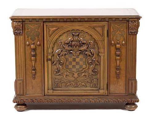 A Renaissance Revival Style Carved Walnut Side Cabinet Height 33 1/4 x width 44 x depth 19 inches.