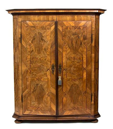 A South German Walnut Parquetry Armoire Height 77 1/2 x width 67 x depth 26 inches.