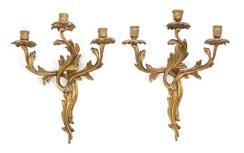 A Pair of Louis XV Style Gilt Bronze Three Light Wall Sconces Height 16 3/4 inches.