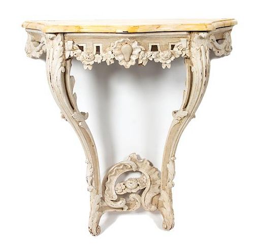 A Louis XV Style Carved and Painted Wall Mounted Console Table Height 32 x width 32 3/4 x depth 16 inches.