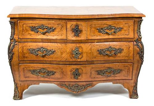 A Louis XV Style Bronze-Mounted Parquetry-Inlaid Tulipwood Commode Height 33 1/2 x width 51 1/2 x depth 23 inches.