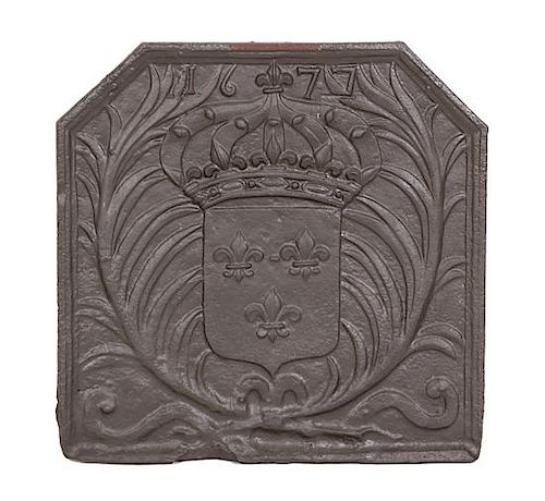A Patinated Cast Iron Fire Back with Coat of Arms Height 28 x width 28 inches.
