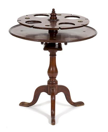 A George III Style Mahogany Tripod Table Height 33 1/2 x diameter 37 inches.
