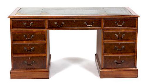 A George III Style Mahogany Double Pedestal Partner's Desk Height 31 x width 62 x depth 30 inches.