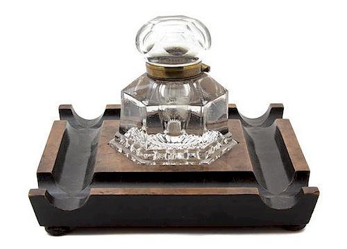 An English Walnut, Parcel Ebonized and Cut Glass Inkwell Height 6 3/4 x 10 1/4 inches square.