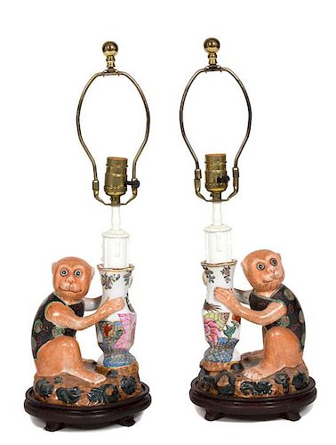 A Pair of Polychromed Ceramic Monkey Lamps Overall height 23 inches.