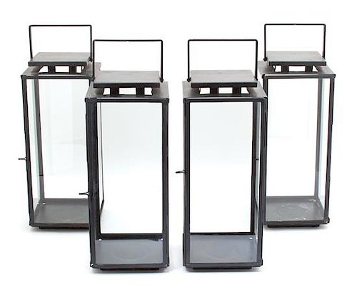 Four Glazed Metal Table Lanterns Height 18 3/4 inches.