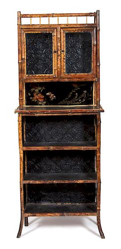 A Victorian Style Burnt Bamboo and Lacquer Display Cabinet Height 73 x width 29 x depth 12 1/2 inches.
