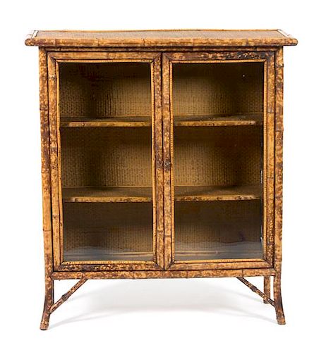 A Victorian Style Bamboo, Black Lacquer and Japanned Bookcase Height 42 x width 28 x depth 13 1/2 inches.