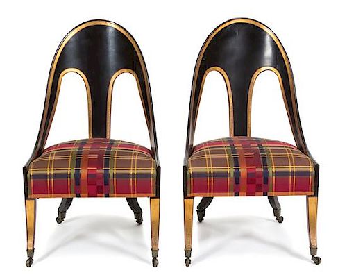 A Pair of Italian Neoclassical Ebonized and Parcel Gilt Decorated Spoon Chairs Height 38 inches.