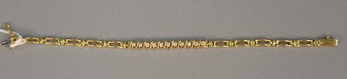 14 karat gold bracelet set with eleven diamonds. 9.1 grams
