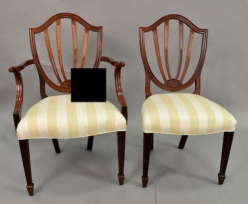 Baker set of eight mahogany dining chairs with shield backs.