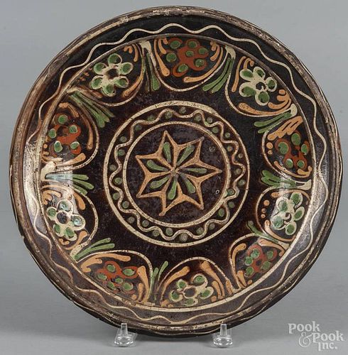 Continental slip decorated redware charger, 19th c., 14 1/4'' dia.