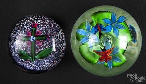 Two glass paperweights, to include a cross flower example, 2 3/4'' dia.