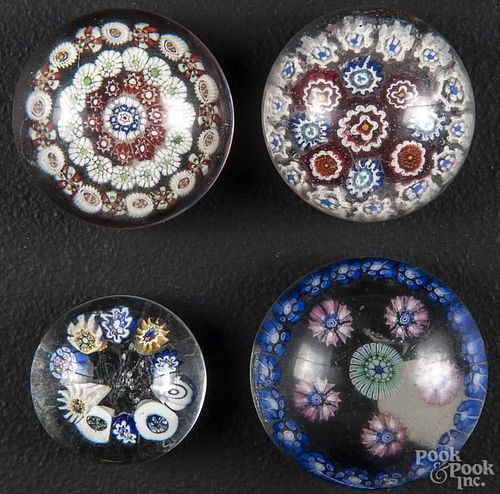 Four antique millefiore paperweights, largest - 2'' dia.