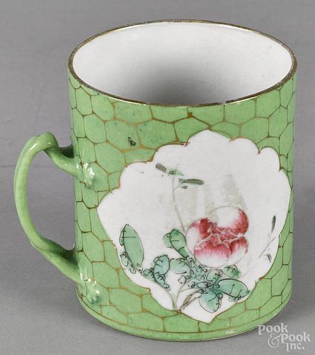 Export porcelain mug, 19th c., with green glaze and two floral vignettes, 4'' h.