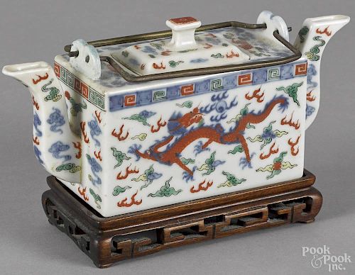 Chinese porcelain teapot, ca. 1900, with dragon decoration, 3 1/2'' h., 8'' w.