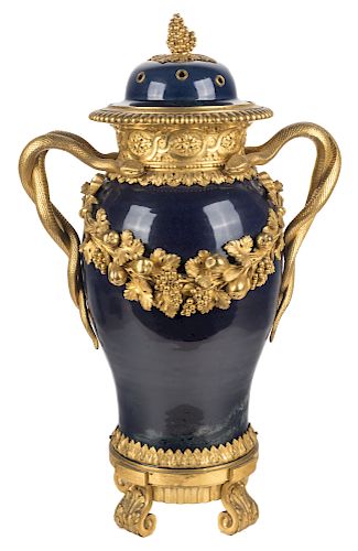A LOUIS XV/XVI ORMOLU-MOUNTED CHINESE PORCELAIN COVERED VASE, WITH LATER SNAKE HANDLES, QIANLONG PERIOD, CIRCA 1770