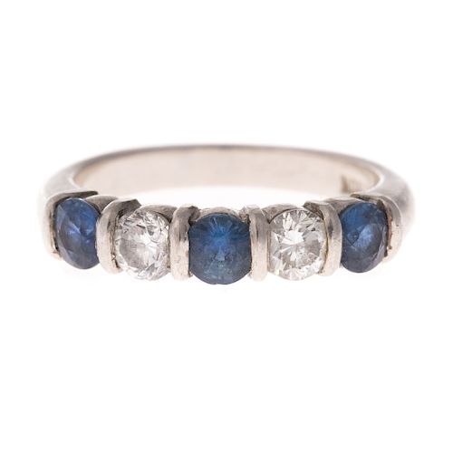 A Lady's Diamond and Sapphire Band in Platinum