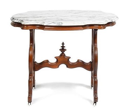 An Occasional Table, Height 29 x width 36 1/2 x depth 24 3/4 inches.