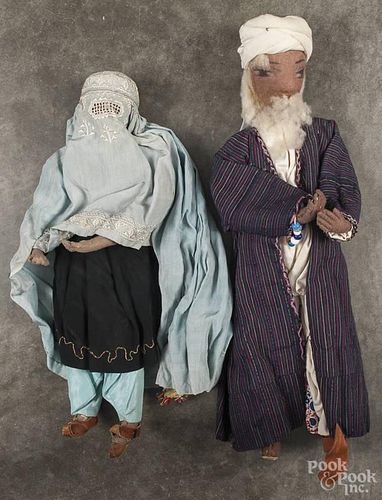 Two antique Muslim cloth dolls with painted facial features, 19'' h. and 16'' h.