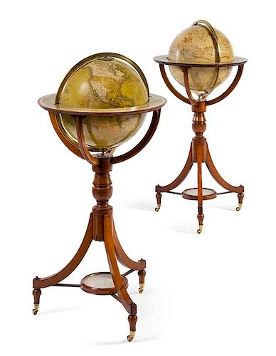 * A Pair of Victorian Mahogany Twelve-Inch Library Globes Height 35 inches.