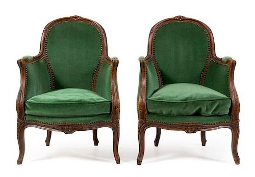 A Pair of Louis XV Beech Fauteuils Height 33 inches.