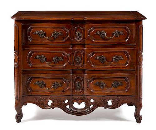 A Louis XV Provincial Walnut Commode Height 38 x width 48 x depth 24 1/2 inches.