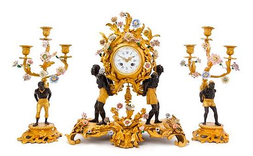 A Louis XV Style Gilt Bronze and Porcelain Mounted Clock Garniture Height of mantel clock 19 1/2 inches.