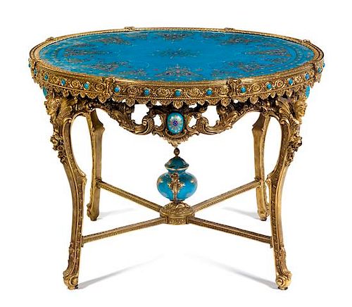 A Louis XV Style Gilt Bronze and Porcelain Inset Gueridon Height 31 x diameter of top 48 inches.